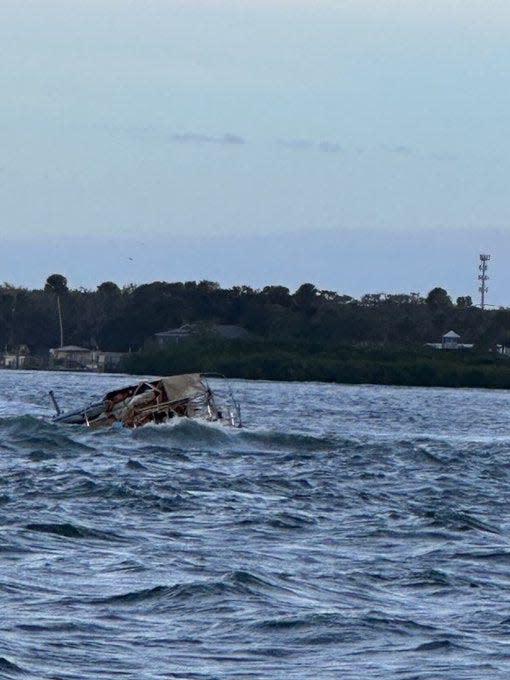 The Coast Guard rescued a man from this sailboat on Thursday night near Ponce Inlet after the boat ran aground and began taking on water and was in danger of capsizing. The Coast Guard stated that the vessel's owner will coordinate the salvage of the boat.