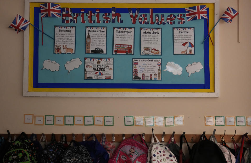 A British Values information board about culture and the way of life on display in the year 3 classroom at the Holy Family Catholic Primary School in Greenwich, London, Wednesday, May 19, 2021. (AP Photo/Alastair Grant)