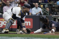 Atlanta Braves' Jorge Soler scores past Milwaukee Brewers catcher Manny Pina during the third inning of the Game 2 in baseball's National League Divisional Series Saturday, Oct. 9, 2021, in Milwaukee. Soler scored from second on a hit by Freddie Freeman. (AP Photo/Morry Gash)