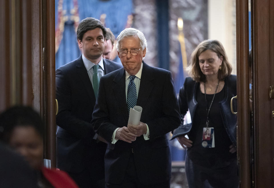 FILE - Senate Majority Leader Mitch McConnell, R-Ky., leaves the chamber after leading the impeachment acquittal of President Donald Trump, at the Capitol in Washington, Feb. 5, 2020. When Trump was impeached after pressuring Ukraine’s leader for “a favor,” all while withholding $400 million in military aid to fight Russia, even the most staunch defense hawks in the Republican Party stood virtually united by Trump’s side. (AP Photo/J. Scott Applewhite, File)