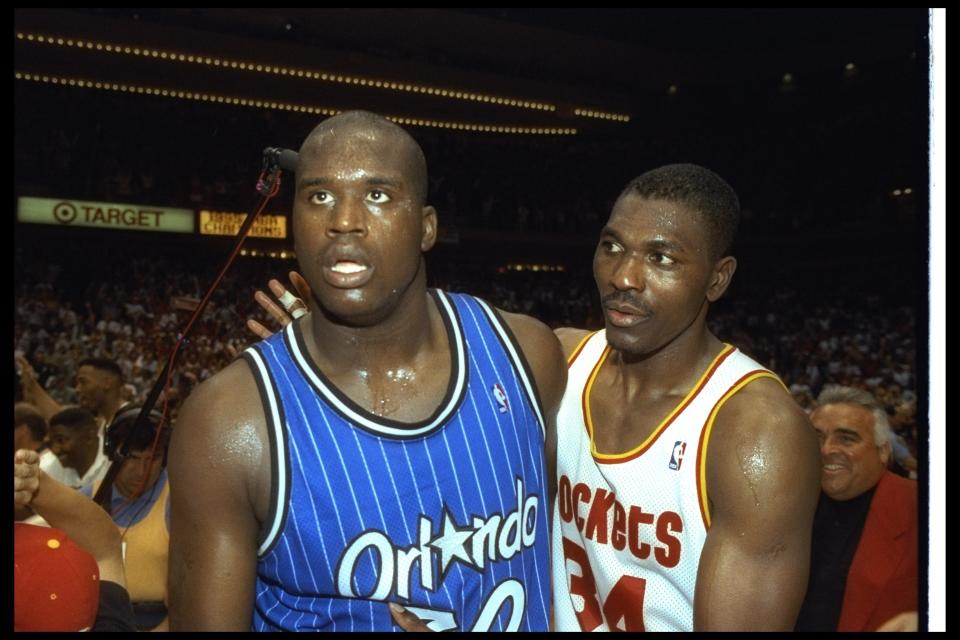 Shaquille O'Neal of the Orlando Magic and Houston Rockets forward Hakeem Olajuwon look on after Game Four of the NBA Finals at the Summit in Houston, Texas. The Rockets won the game, 113-101. (Allsport)