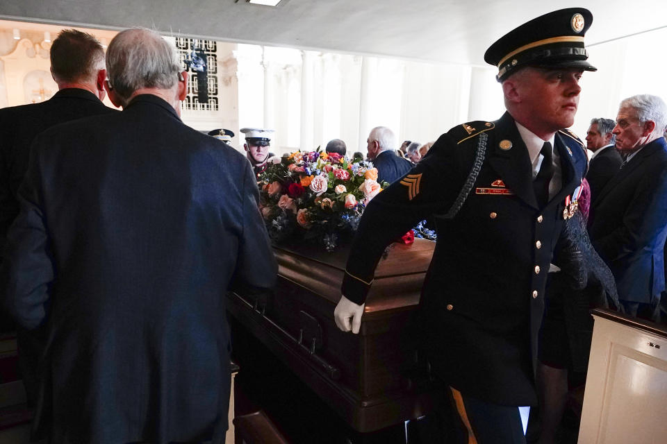 An Armed Forces body bearer team moves the casket of former first lady Rosalynn Carter down the center aisle at the end of a tribute service, at the Glenn Memorial Church, in Atlanta, Tuesday, Nov. 28, 2023. (AP Photo/Brynn Anderson, Pool)