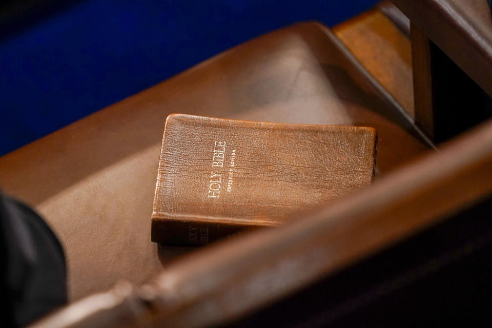 FILE - A Bible is seen on a chair in the House chamber in Washington, Jan. 6, 2023. The Bible will return to the shelves in a northern Utah school district that provoked an outcry after it banned them from middle and elementary schools. The Davis School District said in a statement on Tuesday, June 20, that its board had determined the sacred text was age-appropriate for all school libraries. (AP Photo/Andrew Harnik, File)