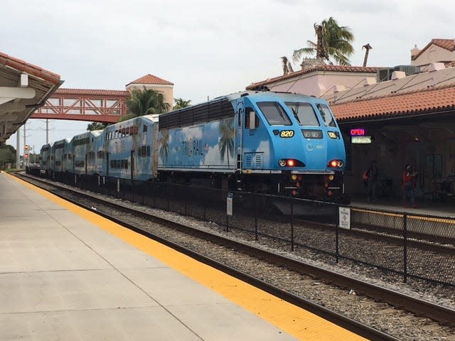A northbound Tri-Rail train pulls away from the Intermodal Transit Center in West Palm Beach.