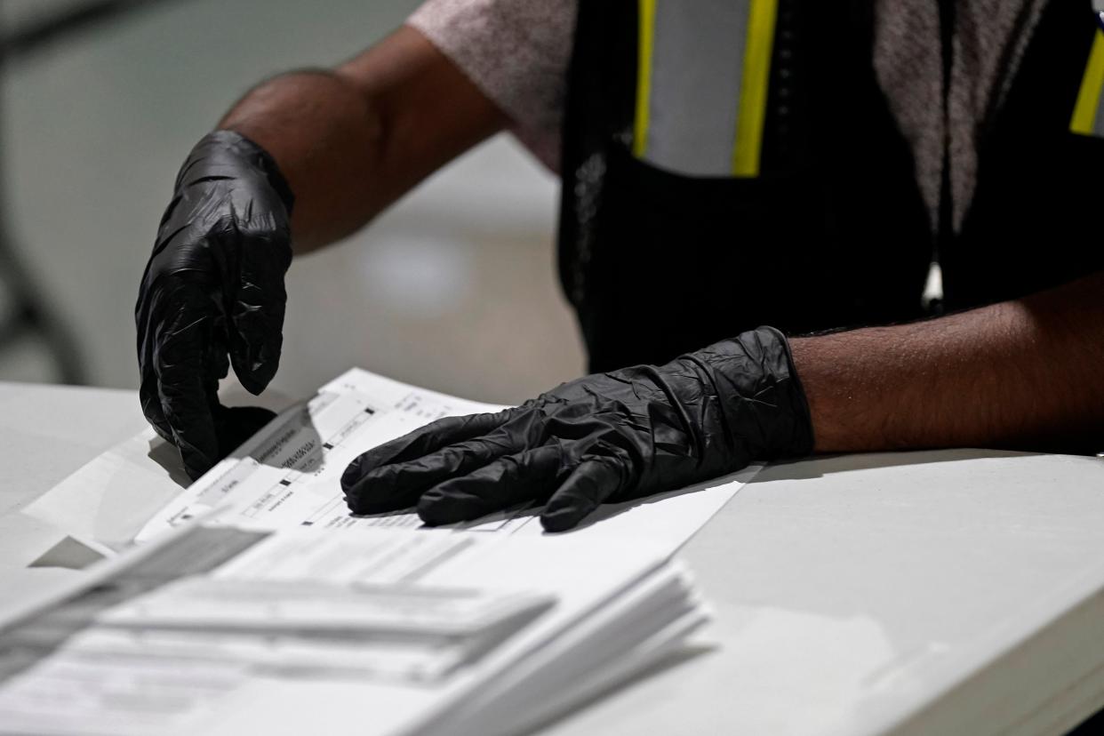 A worker prepares absentee ballots in North Carolina. (AP)