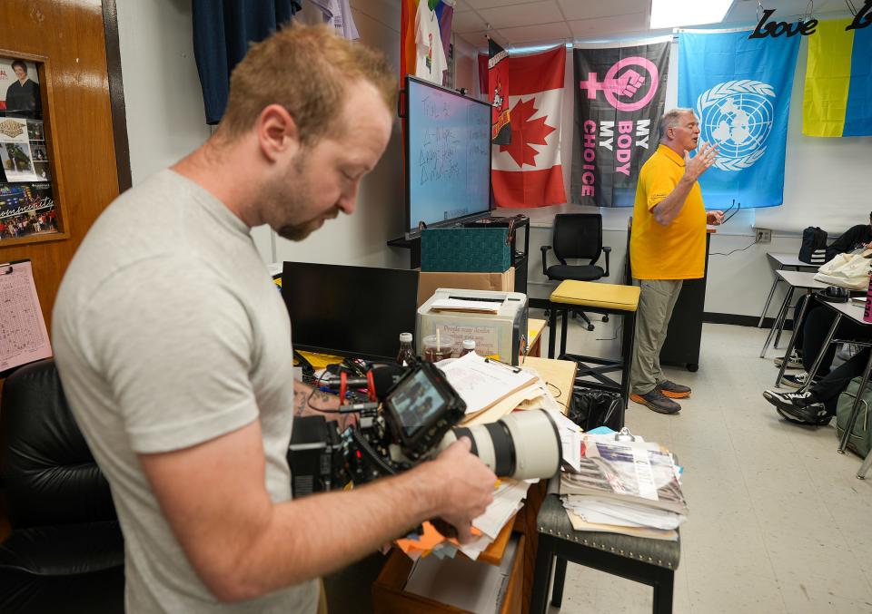 Videographer Tommy Johns records in Joe Gutmann’s class at Central High School. A documentary is being made about Central High's law program, which is led by Gutmann.