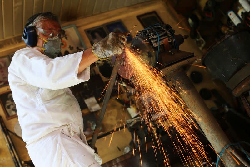 Samurai Suemitsu prepares a katana sword at his home in Curitiba