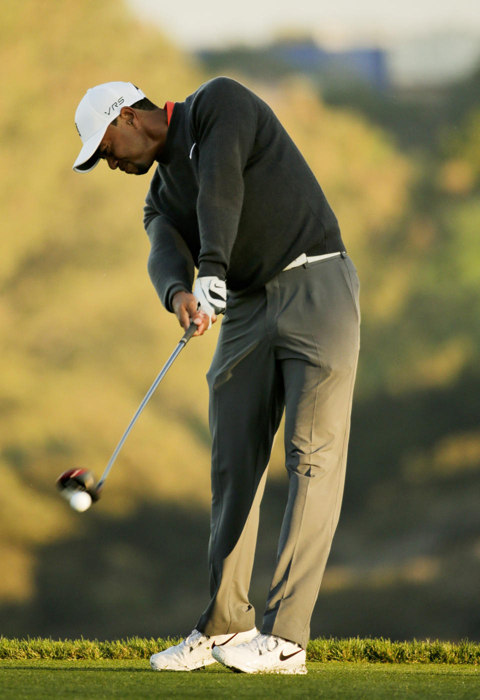 CORRECTS TO FIFTH HOLE, NOT THE FOURTH HOLE - Tiger Woods hits his tee shot on the fifth hole during the pro-am at the Farmers Insurance Open golf tournament at Torrey Pines Golf Course on Wednesday, Jan. 22, 2014, in San Diego. (AP Photo/Chris Carlson)