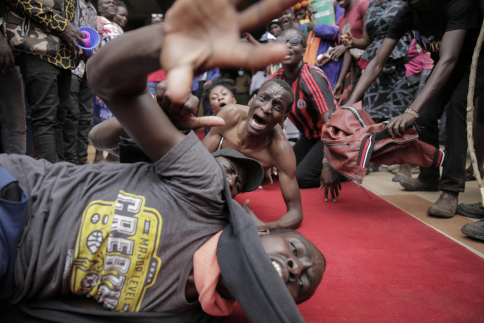 Supporters of presidential candidate Raila Odinga react as he arrives at his campaign headquarters after submitting a petition at the Supreme Court in Nairobi, Kenya Monday, Aug. 22, 2022. Elections, coups, disease outbreaks and extreme weather are some of the main events that occurred across Africa in 2022. Experts say the climate crisis is hitting Africa “first and hardest.” Kevin Mugenya, a senior food security advisor for Mercy Corps said the continent of 54 countries and 1.3 billion people is facing “a catastrophic global food crisis” that “will worsen if actors do not act quickly.” (AP Photo/Brian Inganga)