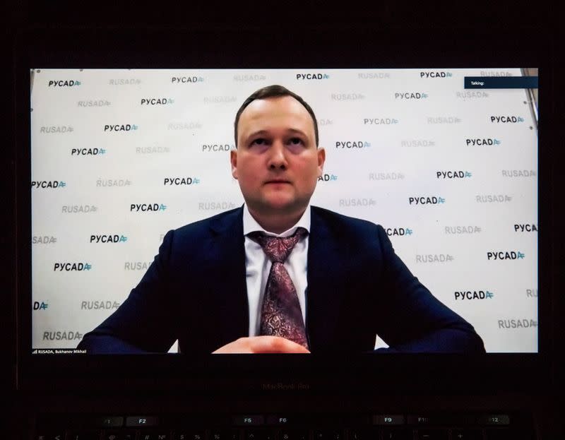 Mikhail Bukhanov, acting Director General of Russian Anti-Doping Agency (RUSADA), is seen on a screen during a news briefing in Moscow,