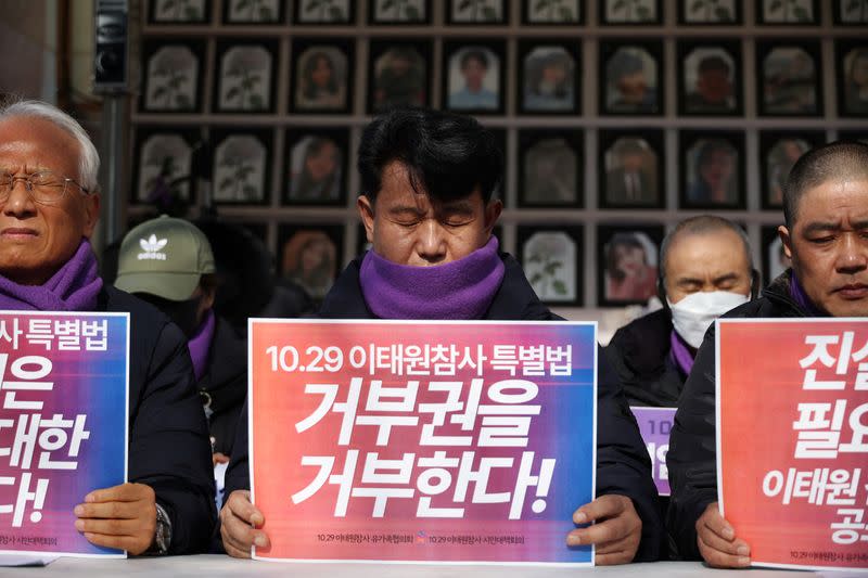 Family members of the Itaewon disaster bereaved families’ group, react during a press conference in Seoul