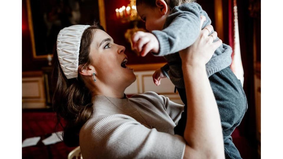 Princess Eugenie holding baby Ernest in the air