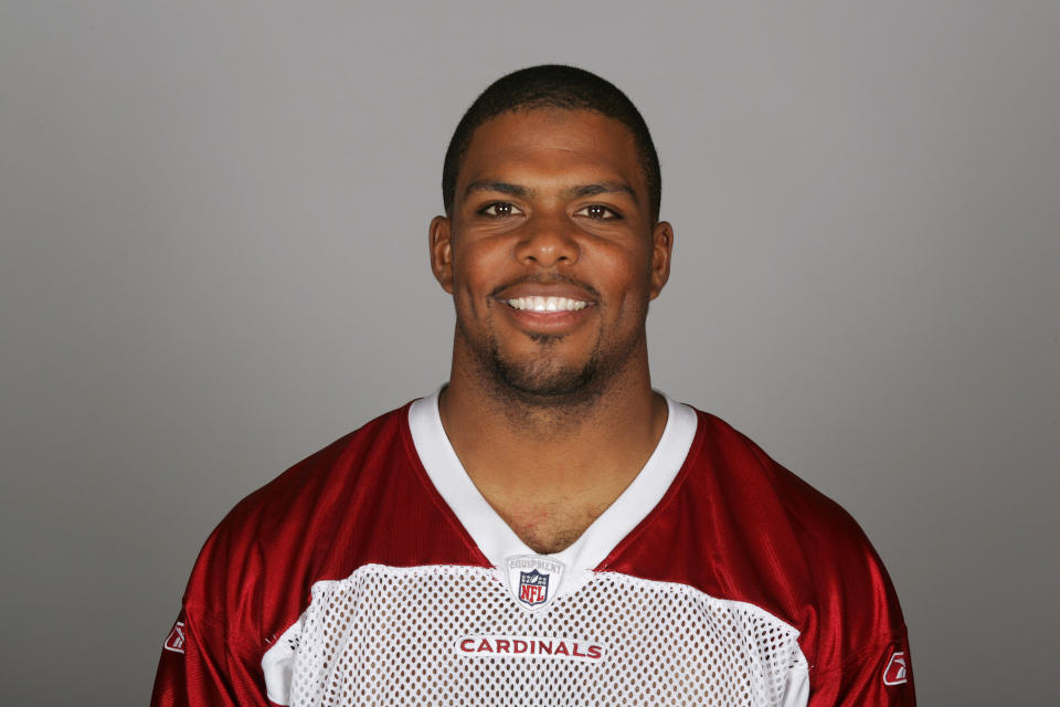 Jason Wright smiles at the camera in a head-and-shoulders pose in his Cardinals team portrait. 