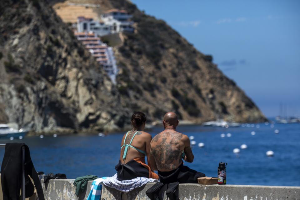 A couple takes a break from the water fun in Avalon.