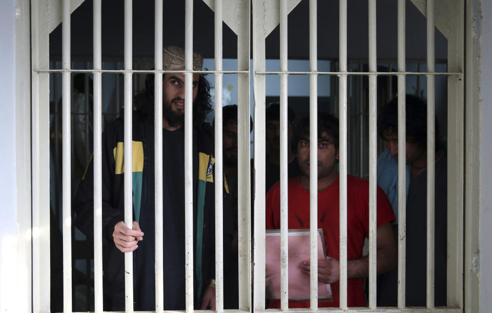 In this Saturday, Dec. 14, 2019, photo, jailed Taliban are seen inside the Pul-e-Charkhi jail in Kabul, Afghanistan. Thousands of Taliban prisoners jailed as insurgents see a peace deal being hammered out in Qatar as their ticket to freedom. Prisoner release is a key pillar of any agreement the U.S. strikes with the Taliban to end Afghanistan’s 18-year war. (AP Photo/Rahmat Gul)