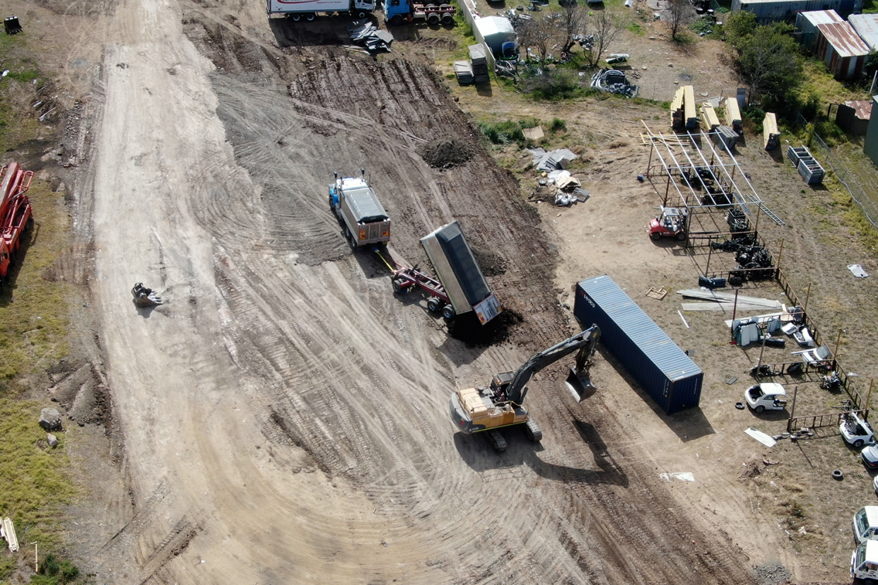 An aerial shot showing a truck dumping contaminated soil at the Rossmore property.