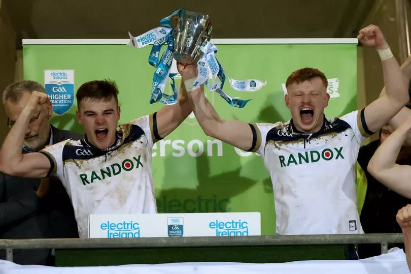 Ulster University's joint captains Ryan Magill and Peter Óg McCartan lift the Sigerson Cup earlier this year in Tralee