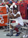 New York Giants running back Saquon Barkley smiles as he sits on the bench during the second half of an NFL football game against the Tampa Bay Buccaneers Sunday, Sept. 22, 2019, in Tampa, Fla. Barkley was injured in the first half. (AP Photo/Jason Behnken)