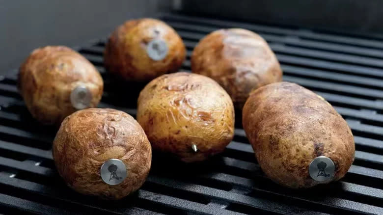 Baked potatoes impaled with nails