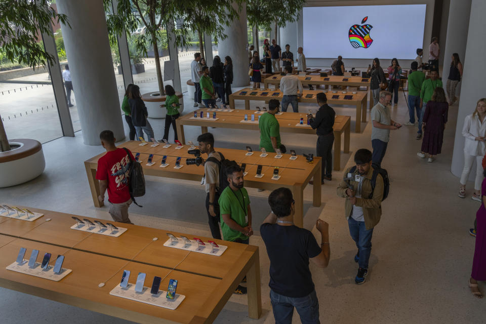 Journalists and bloggers gather during a press preview of India's first Apple Store in Mumbai, India, Monday, April 17, 2023. Apple will open its first retail store in India in Mumbai on Tuesday. (AP Photo/Rafiq Maqbool)