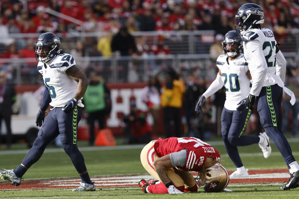 San Francisco 49ers tight end George Kittle (85) is slow to get up after getting hit against the Seattle Seahawks during the first half of an NFL football game in Santa Clara, Calif., Sunday, Dec. 10, 2023. (AP Photo/Josie Lepe)