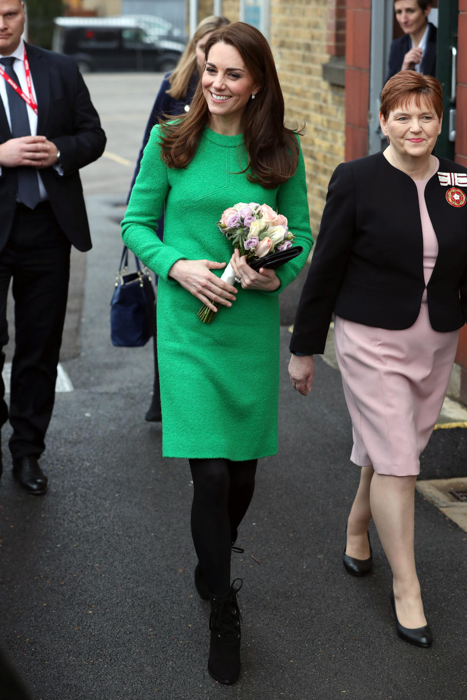 The Duchess of Cambridge visited Lavender Primary School in February wearing a bright green shift dress by Eponine London [Photo: Getty Images]