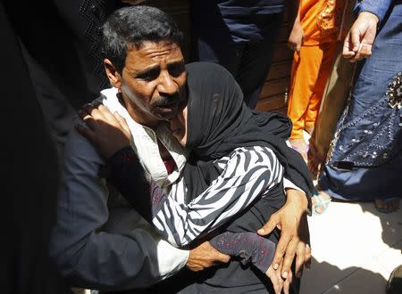 Relatives and families of members of the Muslim Brotherhood and supporters of ousted Egyptian President Mohamed Mursi react outside a court in Minya, south of Cairo, after the sentences of Muslim Brotherhood leader Mohamed Badie and his supporters were announced, June 21, 2014. REUTERS/Mohamed Abd El Ghany