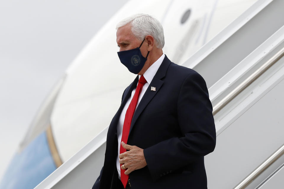 Vice President Mike Pence arrives at Love Field in Dallas, Sunday, June 28, 2020. For more than three years, President Donald Trump instilled such fear in the Republican Party's leaders that most kept criticism of his turbulent leadership or inconsistent politics to themselves. That's beginning to change. While Trump avoids wearing a mask in public, Pence was pictured this weekend wearing a mask and urged other Americans to do the same.(AP Photo/Tony Gutierrez)