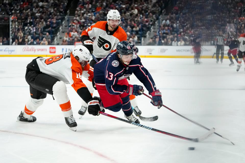 Oct 12, 2023; Columbus, Ohio, USA; Columbus Blue Jackets left wing Johnny Gaudreau (13) gets tripped by Philadelphia Flyers defenseman Marc Staal (18) during the third period of the NHL hockey game at Nationwide Arena. The Blue Jackets lost 4-2.