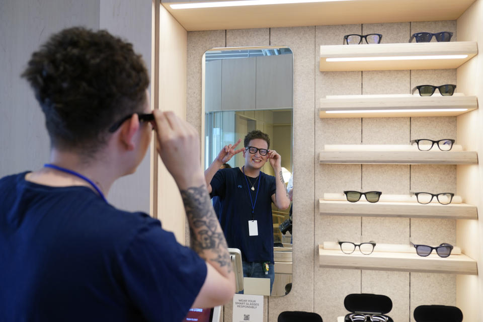 Meta experience expert Askia Luna demonstrates the Ray Ban Stories smart glasses during a preview of the Meta Store in Burlingame, Calif., Wednesday, May 4, 2022. (AP Photo/Eric Risberg)