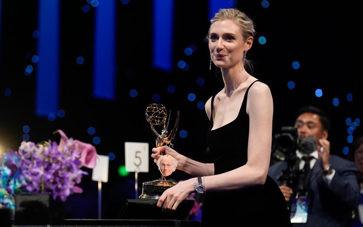 Elizabeth Debicki holds her award for outstanding supporting actress in a drama series for The Crown at the Governors Ball