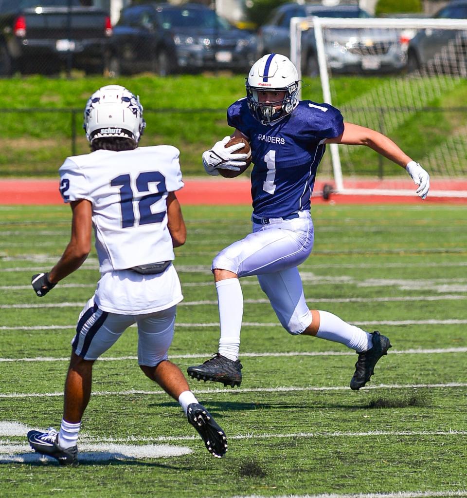 Somerset Berkley's Ian Sullivan looks for running room during Saturday's game against Lawrence.