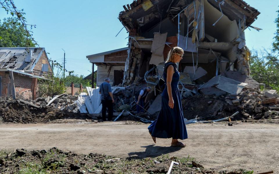 A woman walks past a local Baptist church destroyed by overnight shelling in Kostyantynivka, Donetsk -  Madeleine Kelly/ Zuma Press / eyevine