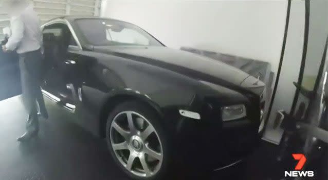 Richard Malborough greeted officers at his luxury mansion after stepping out of his Rolls Royce. Source: 7 News/ Queensland Police