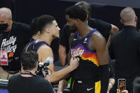 Phoenix Suns guard Devin Booker, left, celebrates with center Deandre Ayton after the Suns defeated the Los Angeles Clippers in Game 2 of the NBA basketball Western Conference Finals, Tuesday, June 22, 2021, in Phoenix. (AP Photo/Matt York)