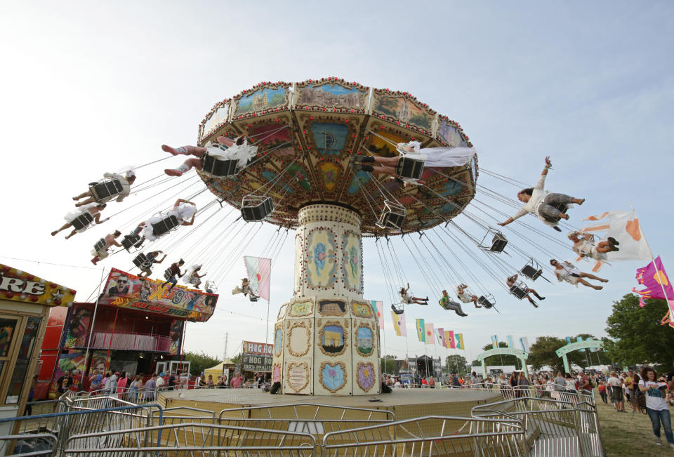 A hen party on a fairground ride at the Isle of Wight Festival, in Seaclose Park, Newport, Isle of Wight.