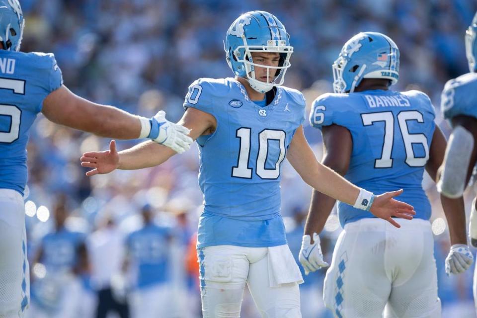 North Carolina quarterback Drake Maye (10) congratulates teammates after leading a scoring drive and taking a 21-3 lead over Minnesota in the second quarter on Saturday, September 16, 2023 at Kenan Stadium in Chapel Hill N.C.