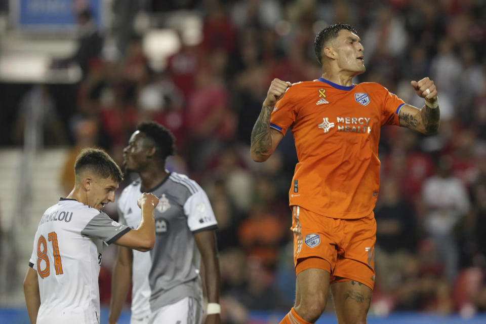 FC Cincinnati's Brandon Vázquez, right, celebrates after scoring a goal against Toronto FC during the first half of an MLS soccer game against Toronto FC in Toronto, Saturday, Sept. 30, 2023. (Chris Young/The Canadian Press via AP)