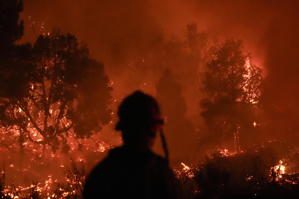 The Bridge Fire burns in Wrightwood, Calif., on Tuesday.