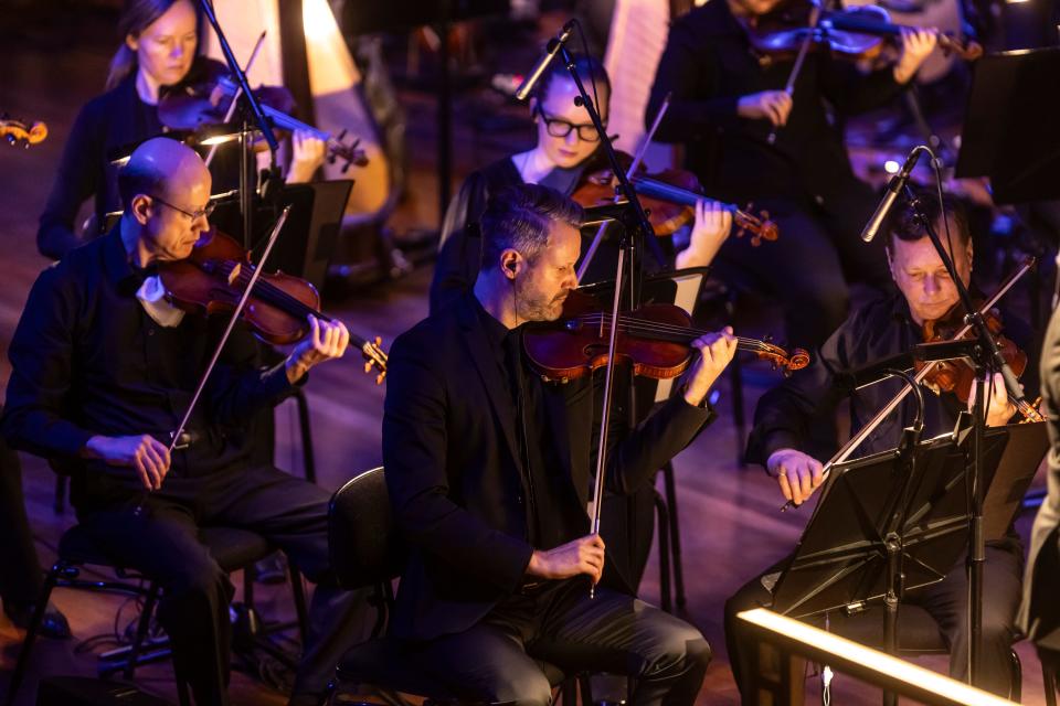 Peter Otto, front center, plays the violin in his new role as the Nashville Symphony’s new concertmaster during a performance of "Encanto" Saturday, March 16, 2024 at Schermerhorn Symphony Center.