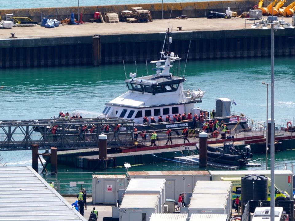 A group of people thought to be migrants are brought in to Dover, Kent, from a Border Force vessel following a small boat (Gareth Fuller/PA)