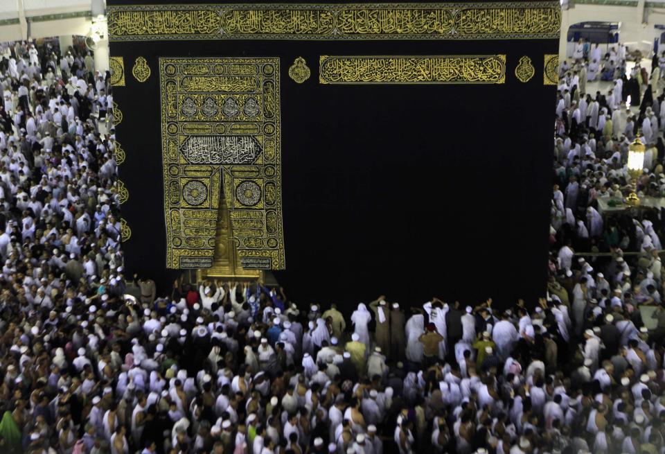 Muslims circle Kaaba and pray during Umrah Mawlid al-Nabawi pilgrimage, at Grand Mosque in Mecca