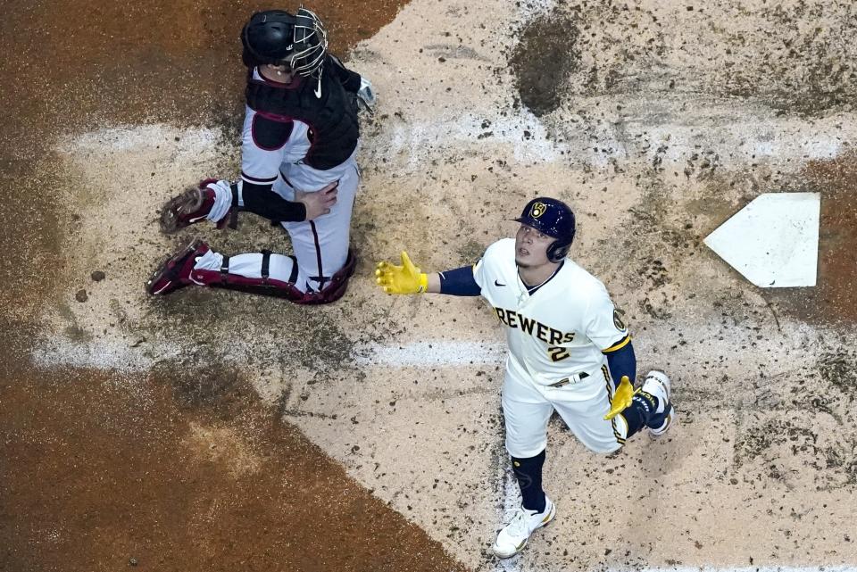 Milwaukee Brewers' Luis Urias reacts after hitting a home run during the third inning of a baseball game against the Arizona Diamondbacks Tuesday, Oct. 4, 2022, in Milwaukee. (AP Photo/Morry Gash)