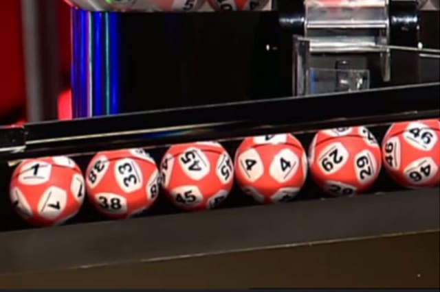 The ball appears to have the numbers 33 and 38.