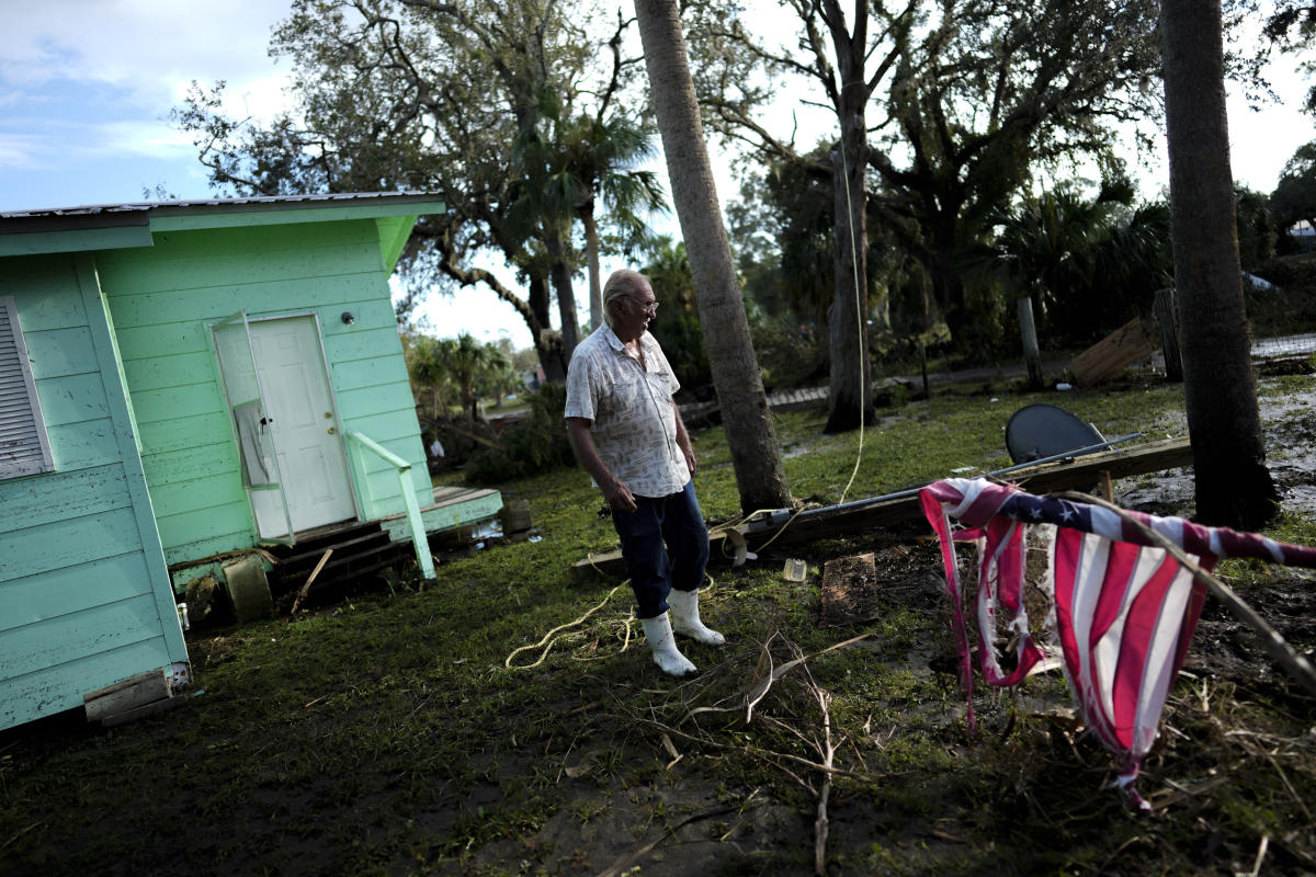 Residents pick through the rubble of lost homes and scattered belongings in  Hurricane Idalia's wake