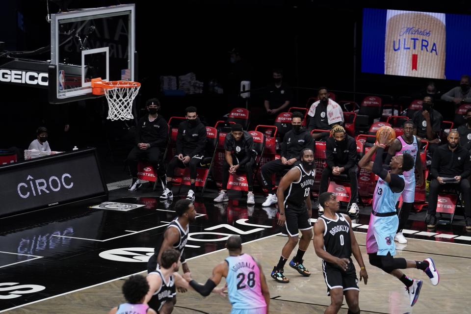 Miami Heat's Bam Adebayo (13) shoots over Brooklyn Nets' Reggie Perry (0) during the second half of an NBA basketball game Saturday, Jan. 23, 2021, in New York. (AP Photo/Frank Franklin II)