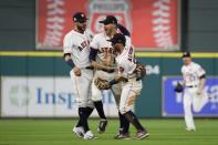 Oct 21, 2017; Houston, TX, USA; Houston Astros second baseman Jose Altuve (27) celebrates with Astros shortstop Carlos Correa (1) and Astros left fielder Marwin Gonzalez (9) after defeating the New York Yankees in game seven of the 2017 ALCS playoff baseball series at Minute Maid Park. Thomas B. Shea-USA TODAY Sports