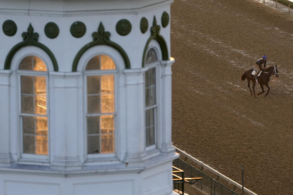 A horse works out at Churchill Downs Friday, April 30, 2021, in Louisville, Ky. The 147th running of the Kentucky Derby is scheduled for Saturday, May 1. (AP Photo/Charlie Riedel)