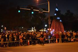 A large crowd gathers to watch the 2019 Parade of Lights.