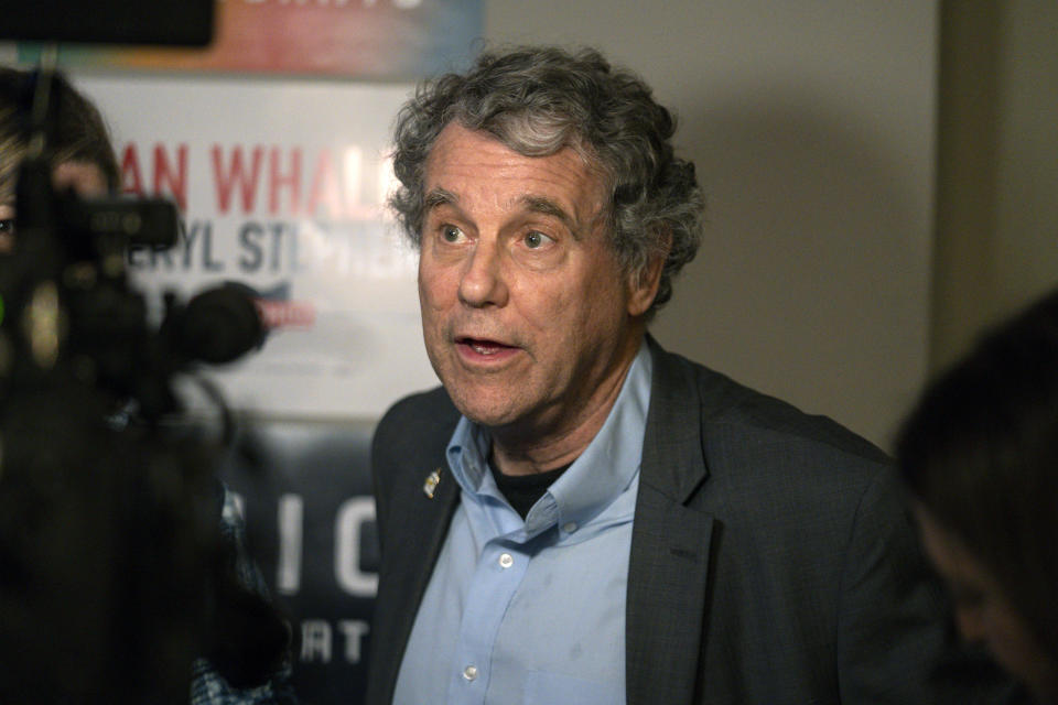 FILE - Sen. Sherrod Brown, D-Ohio, right, speaks with reporters at a rally for Ohio gubernatorial candidate Nan Whaley in Cincinnati, Nov. 3, 2022. Brown has survived a decade of statewide Democratic losses in Ohio by building a reputation as the rare person in his party who can still connect with the white working-class voters who have increasingly shifted to Republicans. But as he heads into what could be a tough reelection, Brown is facing a critical test in the aftermath of a train derailment in an eastern Ohio village.(AP Photo/Jeff Dean, File)